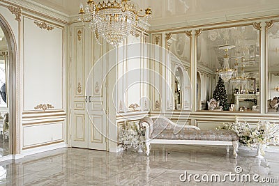 Christmas morning. Classic luxurious apartments with decorated christmas tree and presents. Living with fireplace Stock Photo