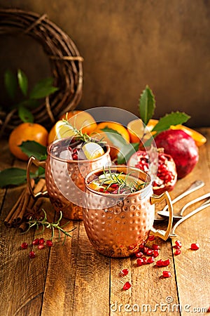 Christmas Moscow mule with pomegranate and orange Stock Photo