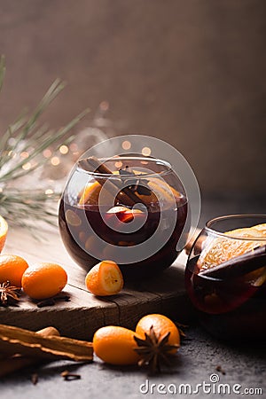 Christmas mulled wine in circle glasses delicious holiday like parties with orange cinnamon star anise spices. Traditional hot Stock Photo