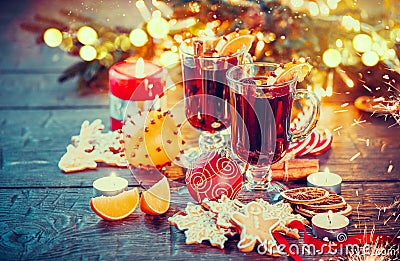 Christmas mulled wine on holiday decorated table Stock Photo