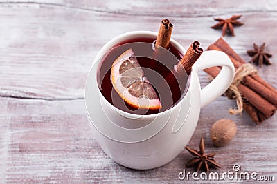 Christmas mulled wine on a rustic wooden table. Stock Photo