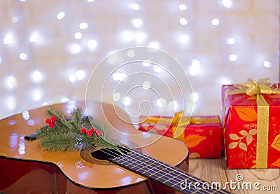 Christmas music background.Guitar and red gifts Stock Photo