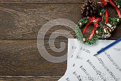 Christmas music note paper with Christmas wreath on wo Stock Photo