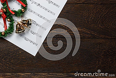 Christmas music note paper with Christmas wreath on wo Stock Photo