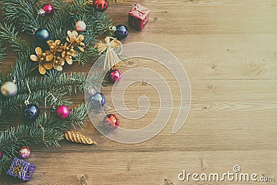 Christmas or new year background with fir tree branches and variety multicolored decorations on wooden table Stock Photo