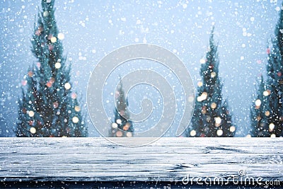 Christmas and New year background with wooden deck table over christmas tree, Stock Photo