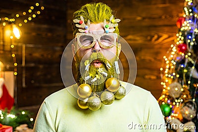 Christmas or New Year barber shop concept. Beard with bauble. Santa in barbershop. Hipster funny Santa at home. New year Stock Photo