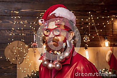 Christmas or New Year barber shop concept. Beard with bauble. Santa in barbershop. Merry christmas and happy new year Stock Photo