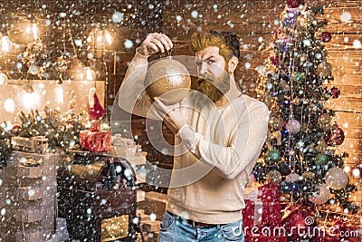 Christmas or New Year barber shop concept. Beard with bauble. Santa in barbershop. Christmas style for modern Santa. Stock Photo