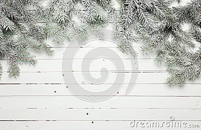 Christmas and New Year decoration composition. Top view of fur-tree branches on wooden background with place for your Stock Photo