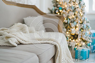 Christmas or new year decoration at Living room interior and holiday home decor concept. Calm image of blanket on a vintage sofa Stock Photo