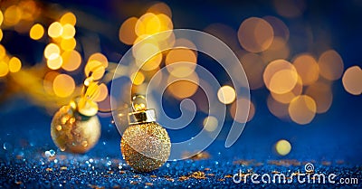 Christmas or New Year festive background with Christmas gold baubles on glitter blue backdrop. Festive winter concept Stock Photo