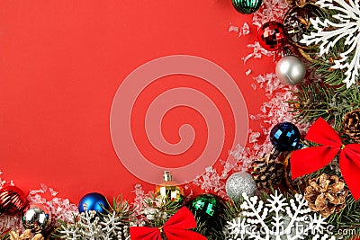 Christmas and New Year frame for text with a Christmas tree and colored Christmas decorations on a red bright background. view fro Stock Photo