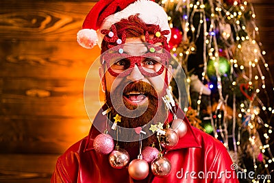 Christmas or New Year funny concept. Beard with bauble. Santa in barber shop. Merry christmas and happy new year. New Stock Photo