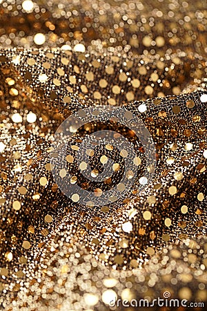 Christmas New Year Gold Glitter background. Holiday abstract texture fabric Stock Photo