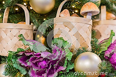Christmas and New Year holidays background. Christmas tree decorated with basket with mushrooms and cabbage. Celebration concept Stock Photo