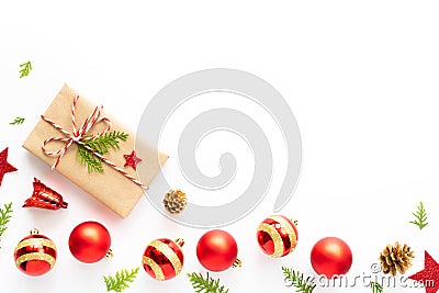 Top view of Gift box, pine cones, red star and bell on a wooden white background. Stock Photo