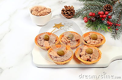 Christmas and New Year's dishes, a set of snacks and refreshing drinks for the holiday table. Plate with tartlets of pate, Stock Photo