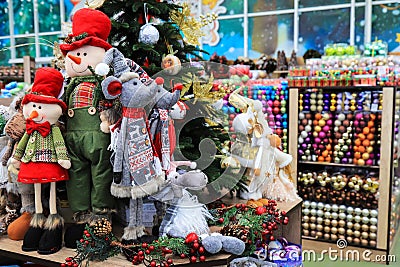 Christmas and New Year`s toys. Toy rat 2020 character and funny dolls in hats on toy store. Stock Photo