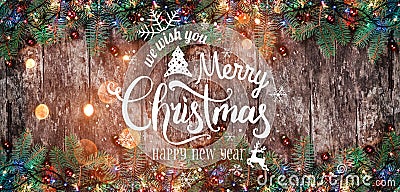 Christmas and New Year Typographical on wooden background with Fir branches. Stock Photo