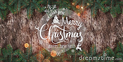 Christmas and New Year Typographical on wooden background with FChristmas and New Year Typographical on wooden background with Fir Stock Photo