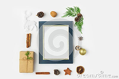 Christmas New Years frame mock up with gift boxes pine cones cinnamon sticks dried oranges anise golden balls deer on white Stock Photo