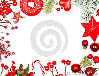 Christmas and New Years holidays composition. Red holly berries, glass balls and green fir branch on white background Stock Photo