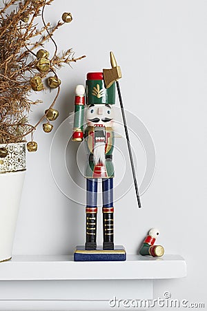 Christmas nutcracker solider broken with dead pine tree Stock Photo