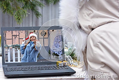 Christmas online greetings during the coronavirus quarantine covid 19. New normal, Safe celebration, social distance, remote Stock Photo