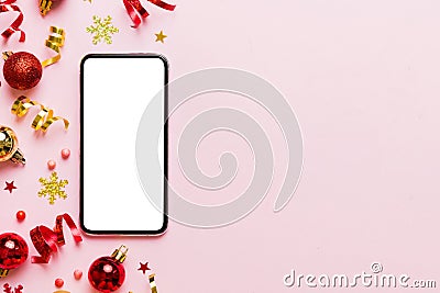 Christmas online shopping from home phone with blank white display top view. smart mobile with copy space on colored Stock Photo