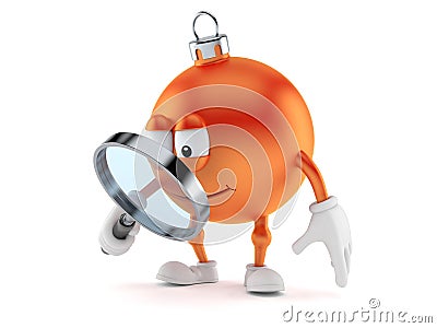 Christmas ornament character looking through magnifying glass Stock Photo