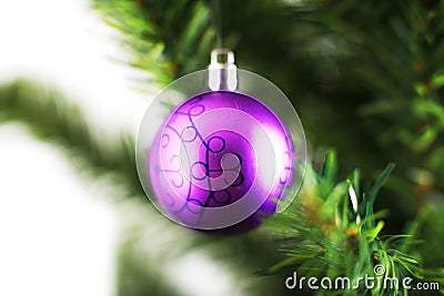 Christmas ornament hanging from a xmas tree branch Stock Photo