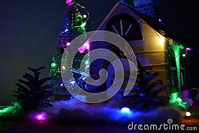 Christmas ornamental house with garland Stock Photo