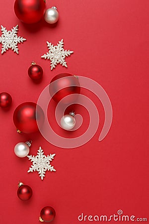 Christmas ornaments decorations background. Red, silver and white glass baubles balls with glitter snowflakes vertical Stock Photo
