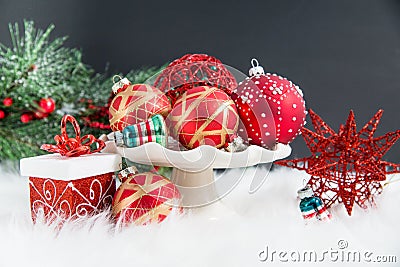 Christmas ornaments, gifts, and evergreens on fur Stock Photo