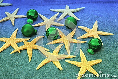 Christmas ornaments and starfish on the beach sand Stock Photo