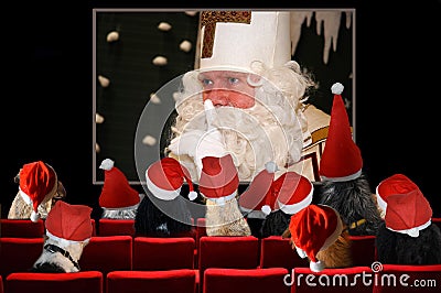 Christmas party, dogs looking Santa Claus movie in Cinema Stock Photo