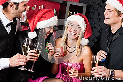 Christmas party friends have fun at bar Stock Photo