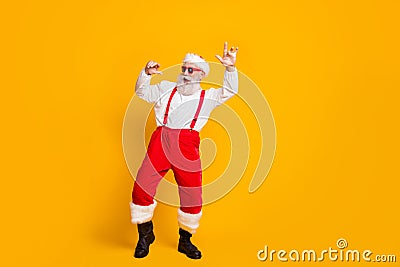 Christmas party hard clubbing. Full body photo of cool funky santa claus hipster in red hat enjoy newyear tradition Stock Photo