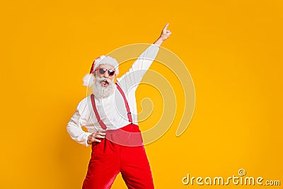 Christmas party hard. Portrait of crazy funny santa claus hipster in red hat enjoy x-mas noel celebration dance raise Stock Photo