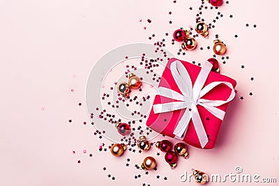 Christmas pastel background with gift and balls confetti Stock Photo