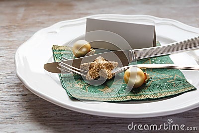 Christmas place setting, plate with napkin, knive and fork Stock Photo