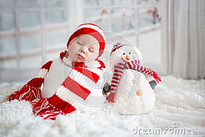 Christmas portrait of cute little newborn baby boy, wearing santa hat Stock Photo