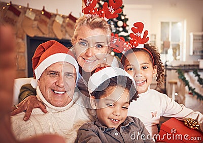 Christmas, portrait and selfie of grandparents with children in home, bond and happy together. Xmas, face and grandma Stock Photo