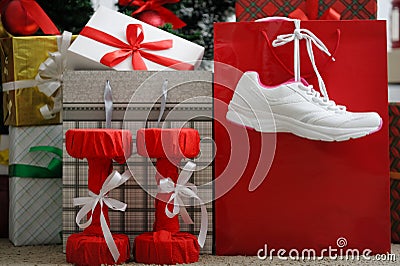 Christmas present. Athletic shoes for running, dumbbells fitness Stock Photo