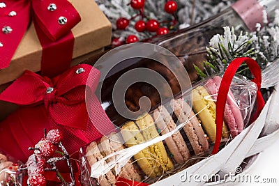 Christmas present in basket with pastry, wine, decor Stock Photo