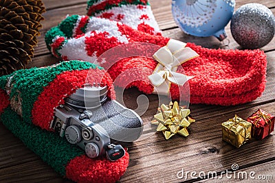 Christmas presents, camera hidden in a holiday sock with Christmas decorations Stock Photo