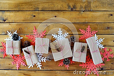 Christmas presents laid on a wooden table background Stock Photo