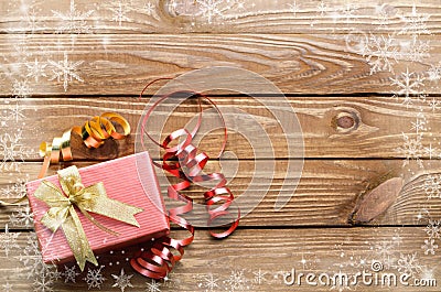 Christmas presents with snow crystal on wooden table background. Stock Photo