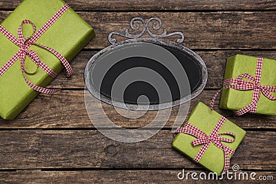 Christmas presents wrapped in green paper with red white checked Stock Photo